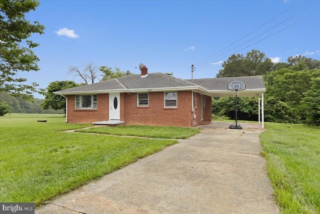 4970 Ridge Rd, Spotsylvania, VA 22551 - view of front of property with concrete driveway, an attached carport, a front lawn, and brick siding