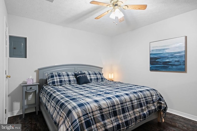 11104 Piney Forest Rd, Bumpass, VA 23024 - bedroom featuring electric panel, baseboards, a textured ceiling, wood finished floors, and a ceiling fan