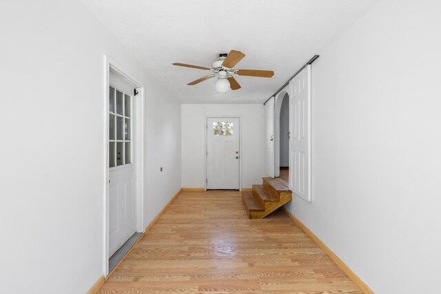 57 Greenbriar Ln, Stuarts Draft, VA 24477 - entryway with light wood finished floors, ceiling fan, and arched walkways