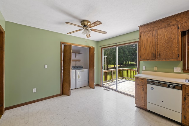 57 Greenbriar Ln, Stuarts Draft, VA 24477 - kitchen with white dishwasher, ceiling fan, washer and dryer, light countertops, and brown cabinets