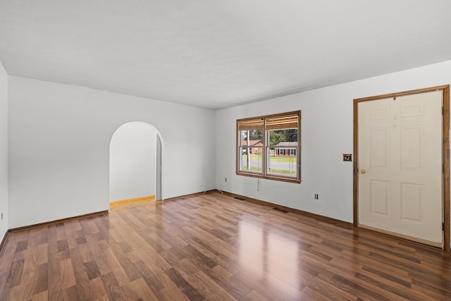 57 Greenbriar Ln, Stuarts Draft, VA 24477 - empty room featuring wood finished floors and arched walkways