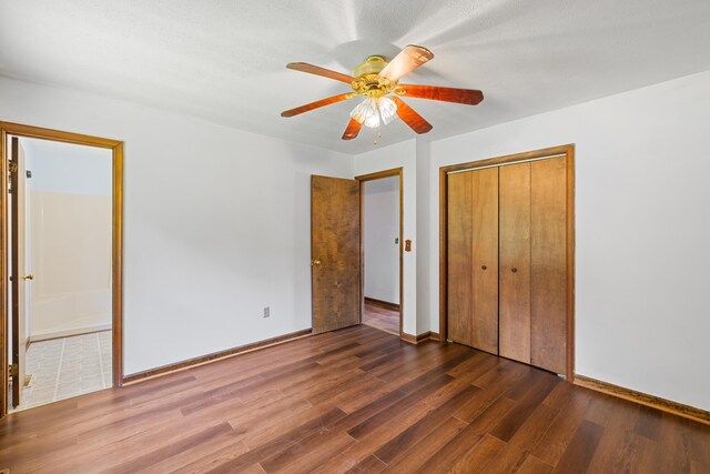 57 Greenbriar Ln, Stuarts Draft, VA 24477 - unfurnished bedroom featuring wood finished floors, a closet, ensuite bath, and a ceiling fan