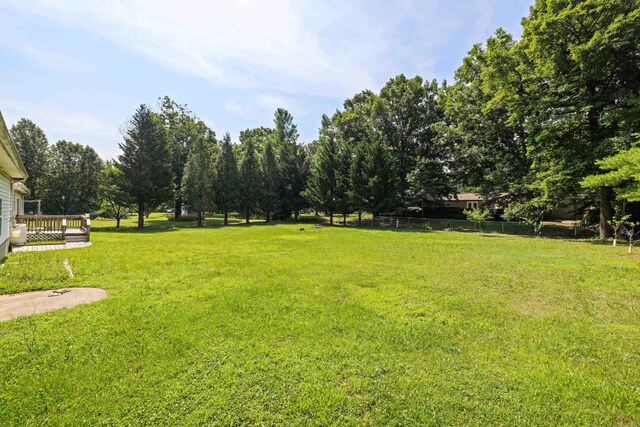 57 Greenbriar Ln, Stuarts Draft, VA 24477 - view of green lawn with a wooden deck