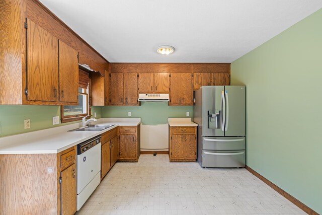 57 Greenbriar Ln, Stuarts Draft, VA 24477 - kitchen with stainless steel refrigerator with ice dispenser, dishwasher, brown cabinetry, light floors, and under cabinet range hood