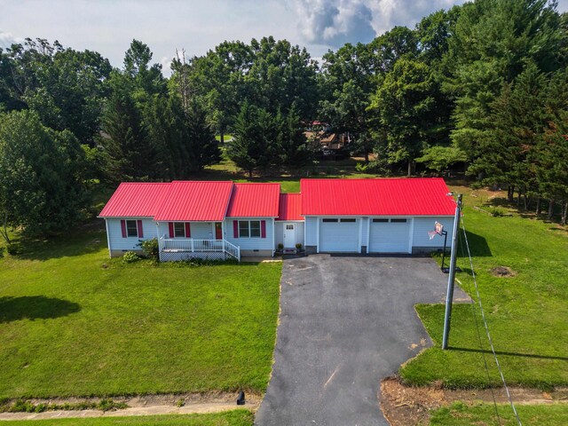57 Greenbriar Ln, Stuarts Draft, VA 24477 - view of front facade featuring a porch, driveway, an attached garage, a front yard, and a metal roof