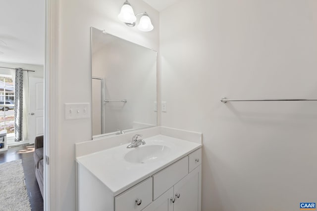 bathroom featuring vanity and wood finished floors