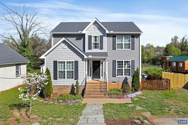 traditional home featuring crawl space and a shingled roof
