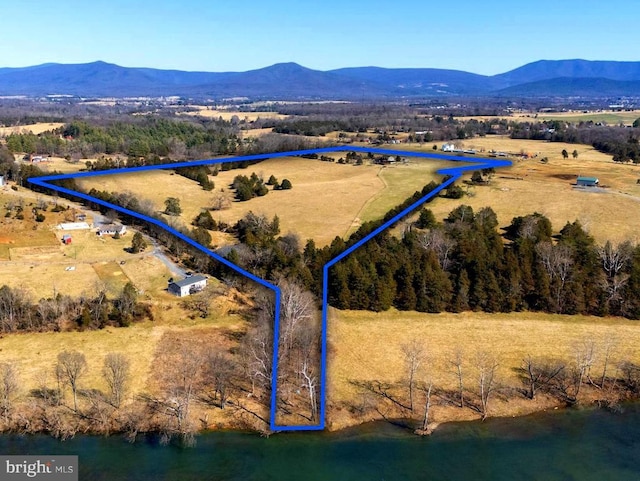 overview of rural landscape with property boundaries highlighted and a mountainous background