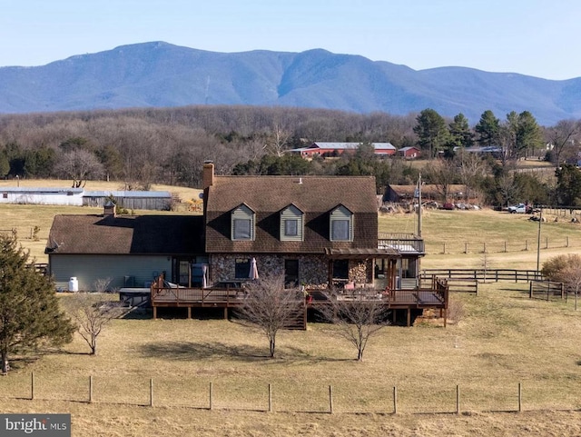 view of mountain background featuring rural landscape