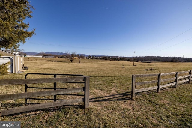 view of yard with a view of countryside and a mountain view