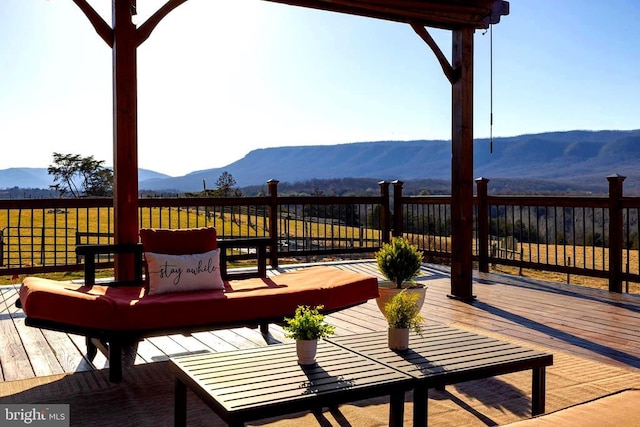 wooden deck featuring a mountain view