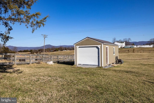 garage featuring a mountain view and a view of countryside