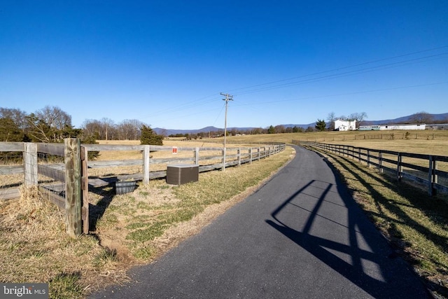 view of street with a view of rural / pastoral area and a mountain view