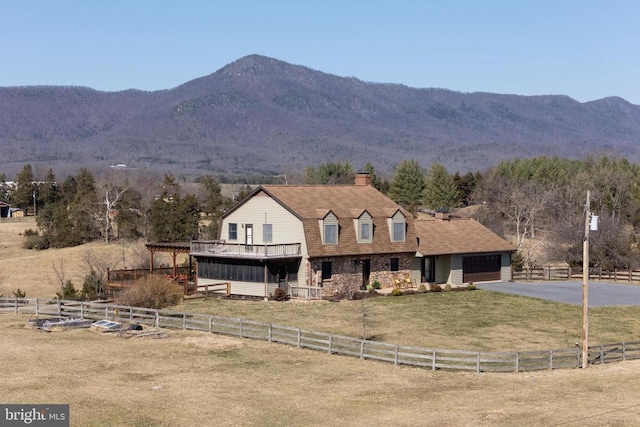 view of mountain background featuring rural landscape