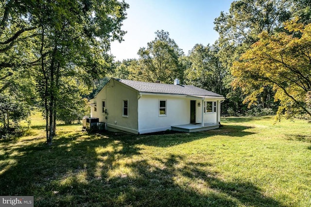 1055 Hacktown Rd, Keswick, VA 22947 - back of property featuring stucco siding and a yard