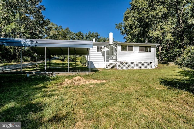 1055 Hacktown Rd, Keswick, VA 22947 - rear view of house featuring a lawn and entry steps