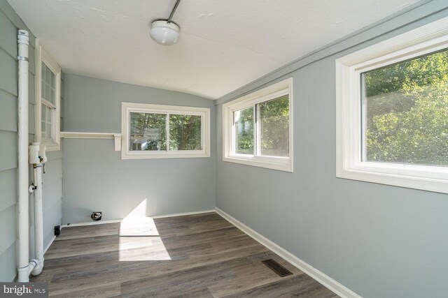1055 Hacktown Rd, Keswick, VA 22947 - spare room featuring vaulted ceiling, wood finished floors, and baseboards
