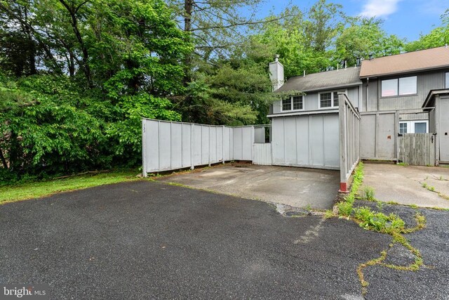 133 Woodlake Dr, Charlottesville, VA 22901 - view of parking / parking lot featuring fence