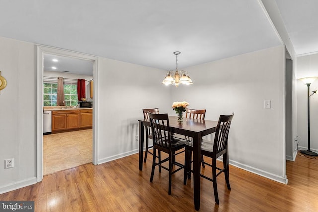 133 Woodlake Dr, Charlottesville, VA 22901 - dining area featuring light wood-type flooring, a chandelier, and baseboards