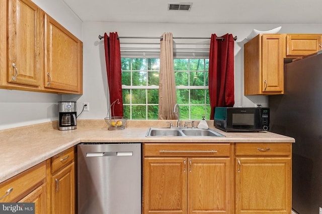 133 Woodlake Dr, Charlottesville, VA 22901 - kitchen with black appliances, a sink, and light countertops