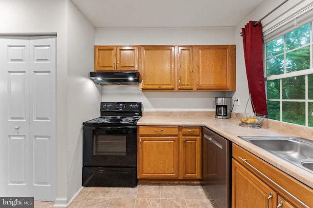 133 Woodlake Dr, Charlottesville, VA 22901 - kitchen with black range with electric cooktop, stainless steel dishwasher, under cabinet range hood, light countertops, and brown cabinets
