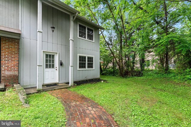 133 Woodlake Dr, Charlottesville, VA 22901 - property entrance featuring a yard and brick siding