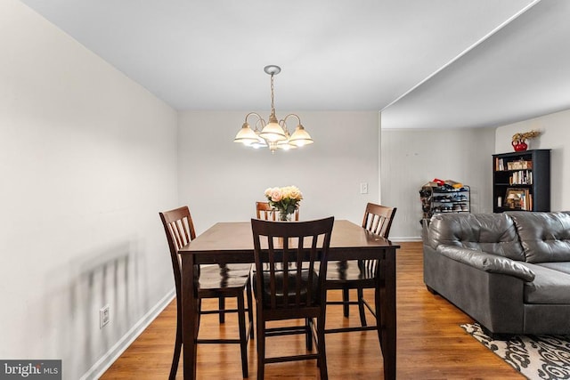 133 Woodlake Dr, Charlottesville, VA 22901 - dining space with a chandelier, wood finished floors, and baseboards