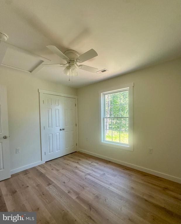 6273 Tatum Rd, Culpeper, VA 22701 - unfurnished bedroom with baseboards, wood finished floors, and a ceiling fan