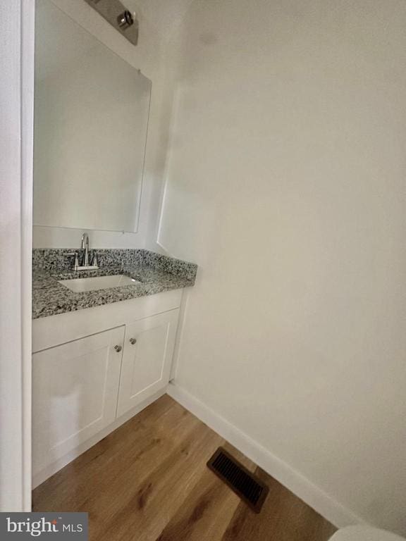 6273 Tatum Rd, Culpeper, VA 22701 - bathroom featuring wood finished floors, vanity, and baseboards
