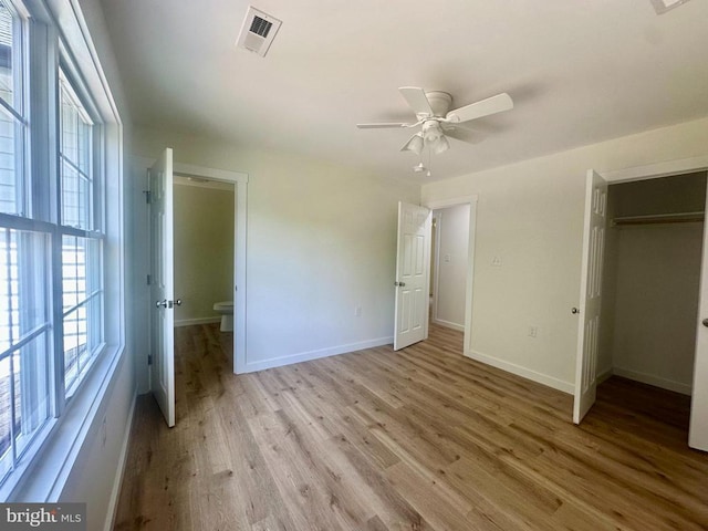 6273 Tatum Rd, Culpeper, VA 22701 - unfurnished bedroom with light wood finished floors, baseboards, a closet, ensuite bathroom, and ceiling fan