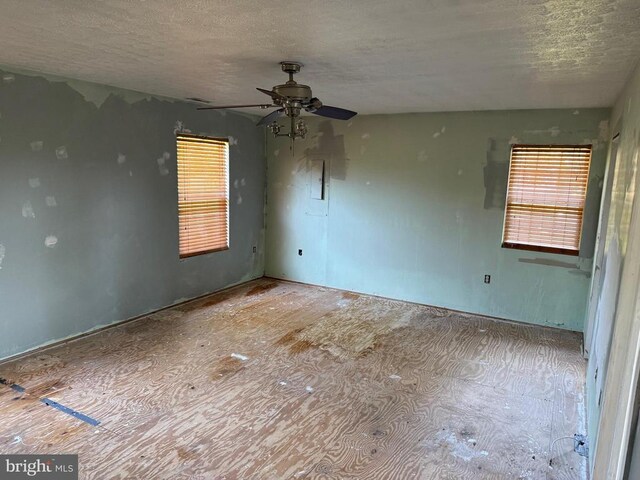231 Derby Ln, Louisa, VA 23093 - empty room with ceiling fan and a textured ceiling