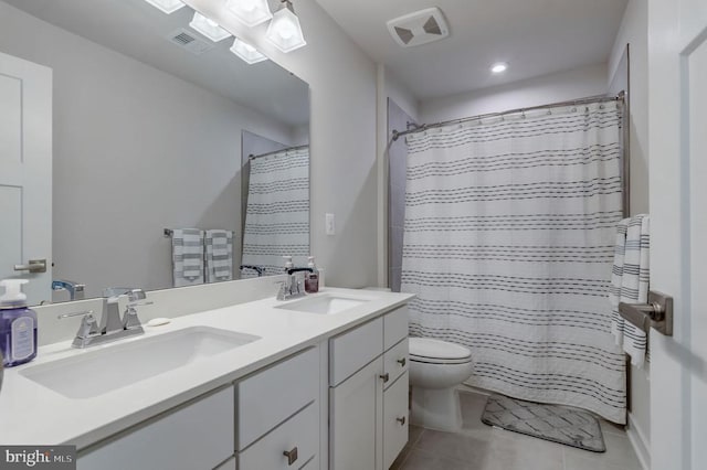 11316 Oakville Ln, Spotsylvania, VA 22551 - bathroom with toilet, tile patterned floors, double vanity, recessed lighting, and curtained shower