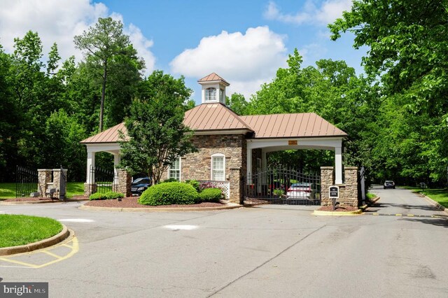 11316 Oakville Ln, Spotsylvania, VA 22551 - view of asphalt road featuring curbs, a gate, and a gated entry