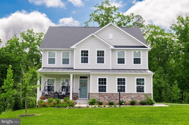 11316 Oakville Ln, Spotsylvania, VA 22551 - view of front of house with a standing seam roof, covered porch, and a front lawn