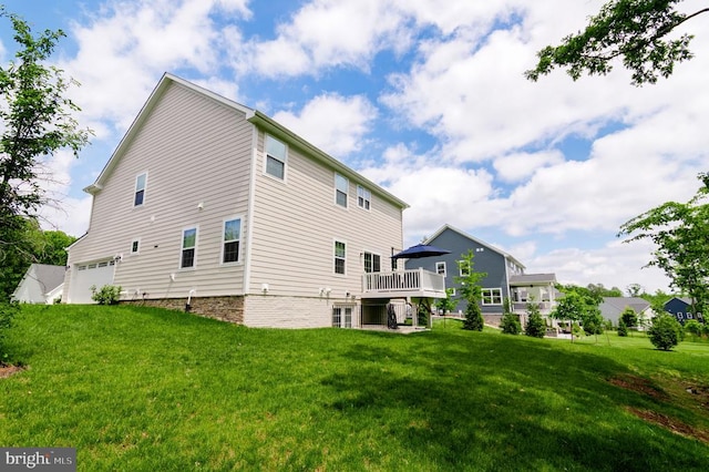 11316 Oakville Ln, Spotsylvania, VA 22551 - back of house featuring a yard, an attached garage, and a deck