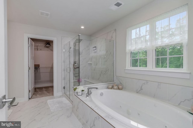 11316 Oakville Ln, Spotsylvania, VA 22551 - full bathroom featuring a tub with jets, a shower stall, marble finish flooring, a walk in closet, and baseboards