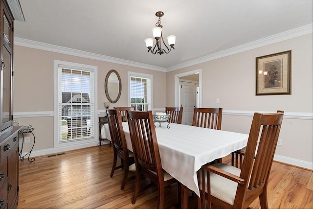 15 Devonshire Ct, Fishersville, VA 22939 - dining area featuring a chandelier, light wood-type flooring, ornamental molding, and baseboards