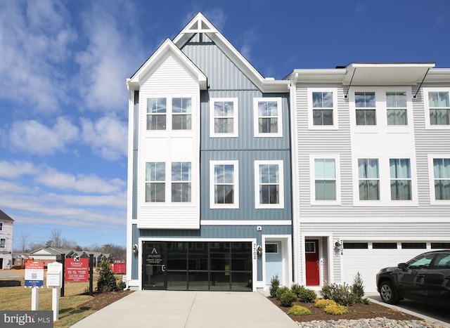 7713 Harlow Cir, Spotsylvania, VA 22551 - multi unit property featuring an attached garage, board and batten siding, and driveway