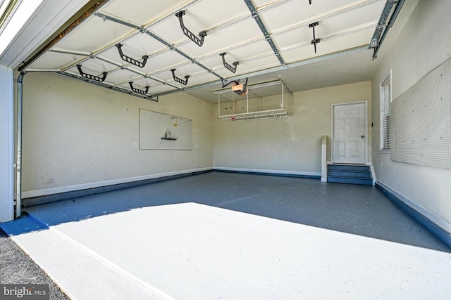 299 Sunset Loop, Mineral, VA 23117 - garage featuring baseboards and a garage door opener