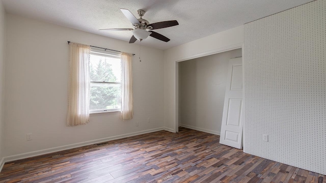 822 Meadowlark Dr, Harrisonburg, VA 22850 - spare room featuring dark wood-type flooring, ceiling fan, a textured ceiling, and baseboards