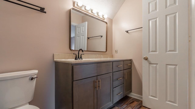 822 Meadowlark Dr, Harrisonburg, VA 22850 - bathroom featuring vanity, toilet, wood finished floors, lofted ceiling, and baseboards