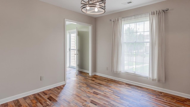 822 Meadowlark Dr, Harrisonburg, VA 22850 - unfurnished room with a chandelier, wood finished floors, and plenty of natural light