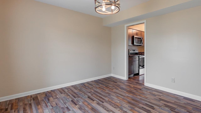 822 Meadowlark Dr, Harrisonburg, VA 22850 - unfurnished room featuring a chandelier, dark wood-type flooring, and baseboards