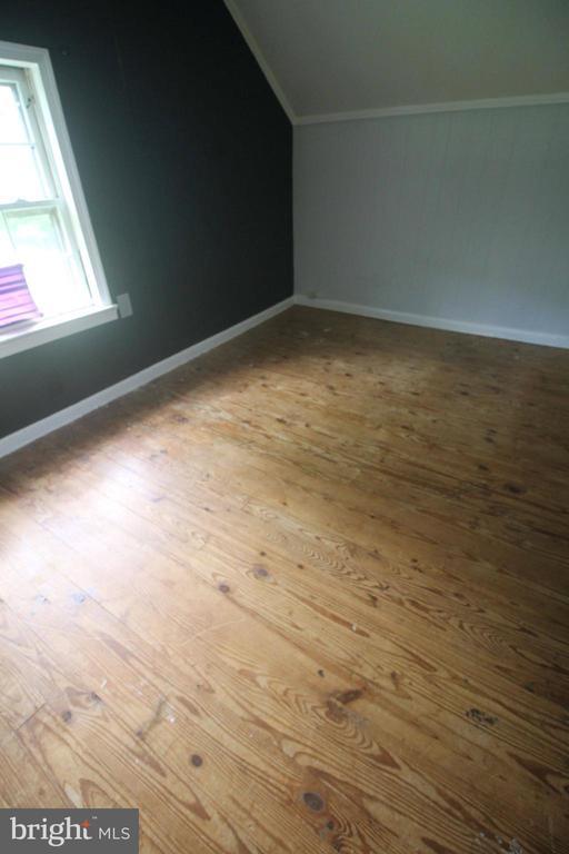  - bonus room with vaulted ceiling and hardwood / wood-style floors