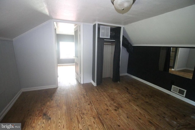  - additional living space with lofted ceiling and wood finished floors