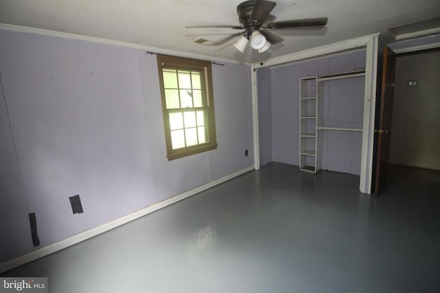  - unfurnished bedroom with concrete floors, a closet, and a ceiling fan