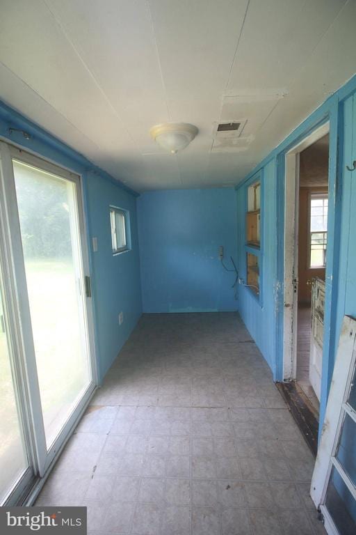  - spare room with tile patterned floors