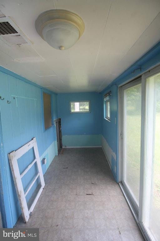  - unfurnished room with light floors