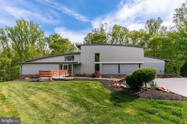  - back of house with a yard and a deck