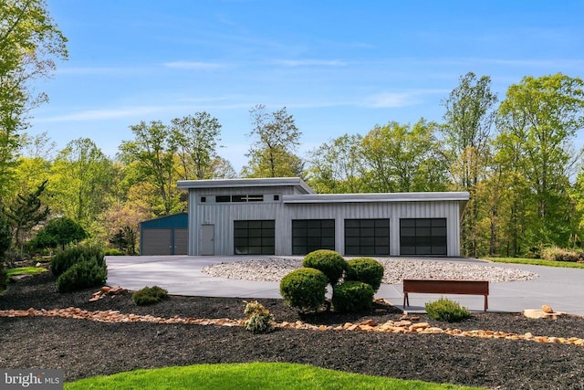  - garage featuring driveway